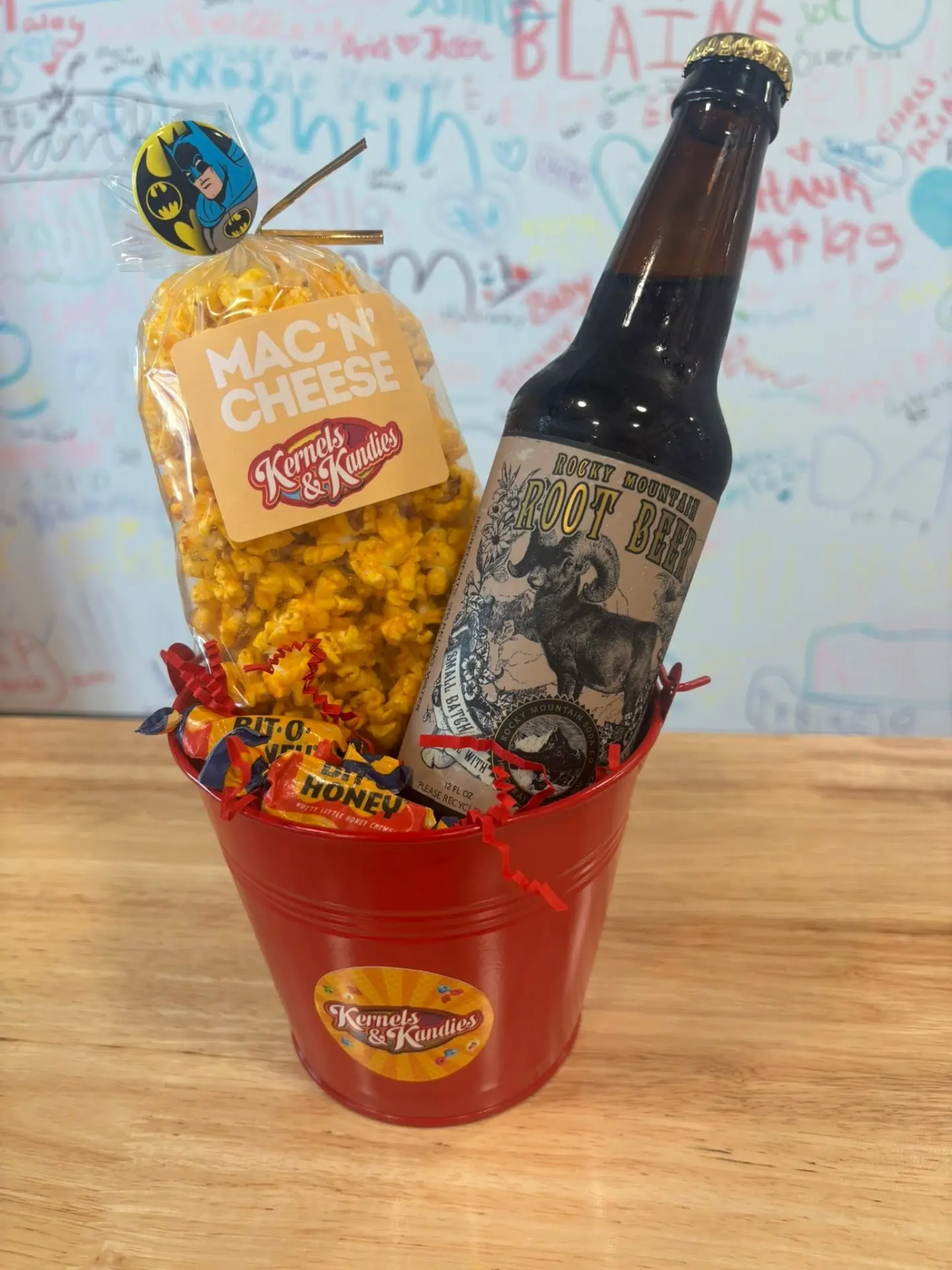 Small red pail with Mac 'N Cheese popcorn and root beer