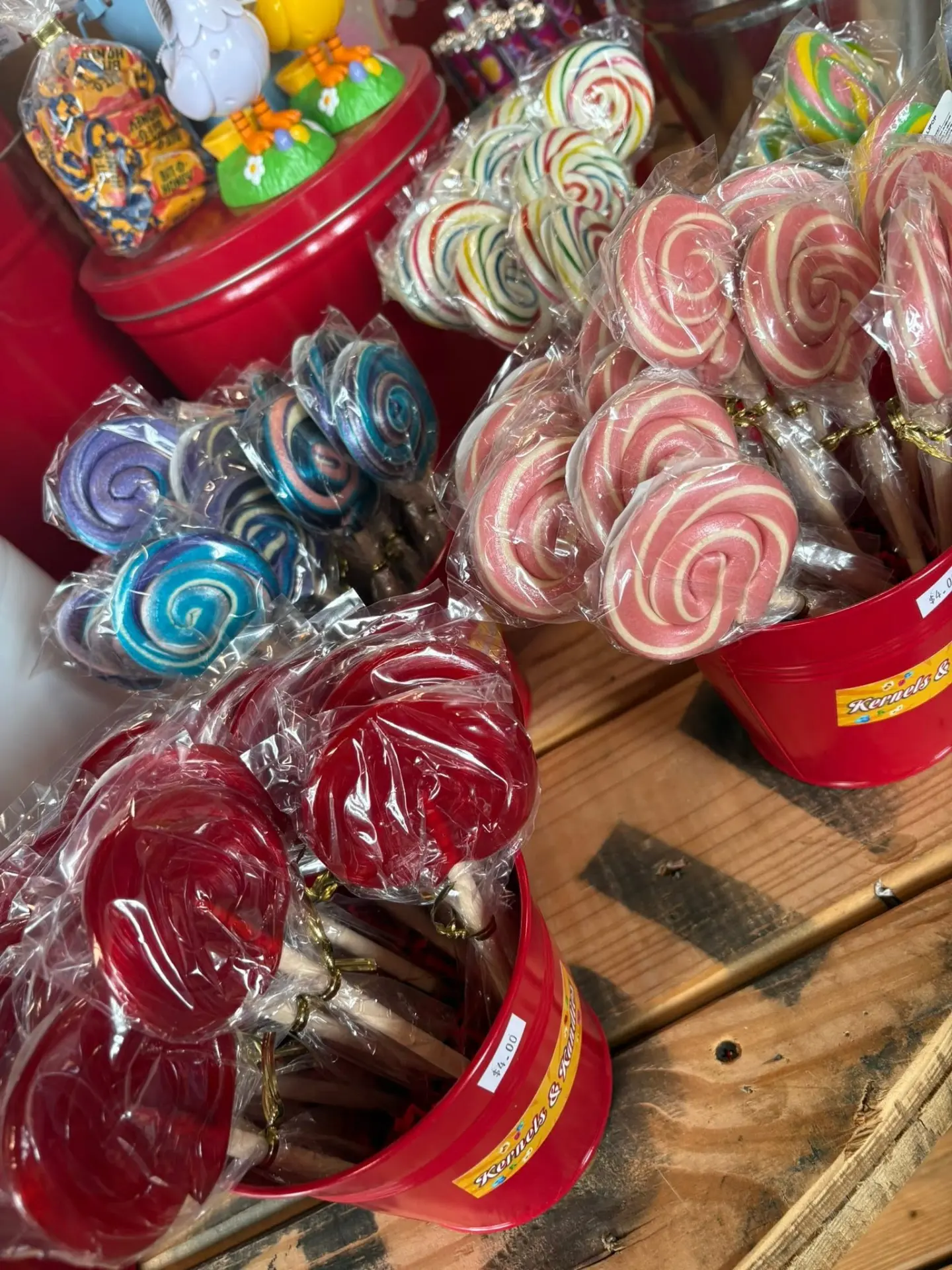 Buckets of swirled lollipops in the candy shop